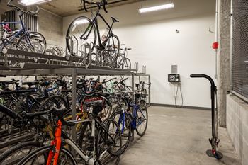a rack full of bikes in a garage